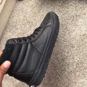 Black leather snow and rain sneakers